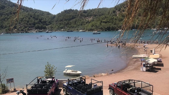 Marmaris'in önemli turizm bölgelerinden Kızkumu Plajı'nda hayat normale dönmeye başladı