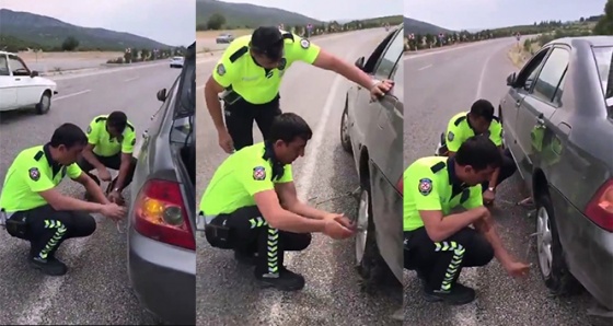 Yolda kalan sürücünün imdadına trafik polisleri yetişti